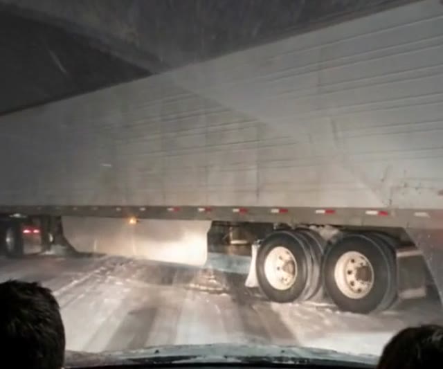 A jackknifed semi trailer blocking every lane of a frozen bridge - Ankin Law dramatization