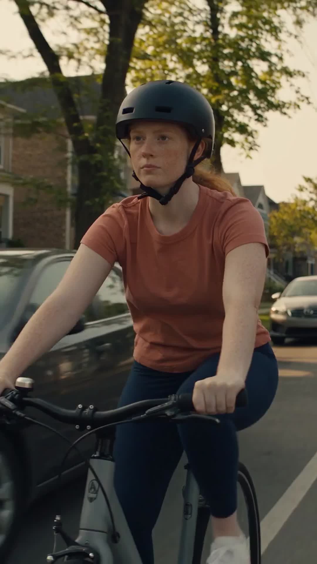 Cyclist down in a Chicago bike lane beside the open door of a parked car - Ankin Law