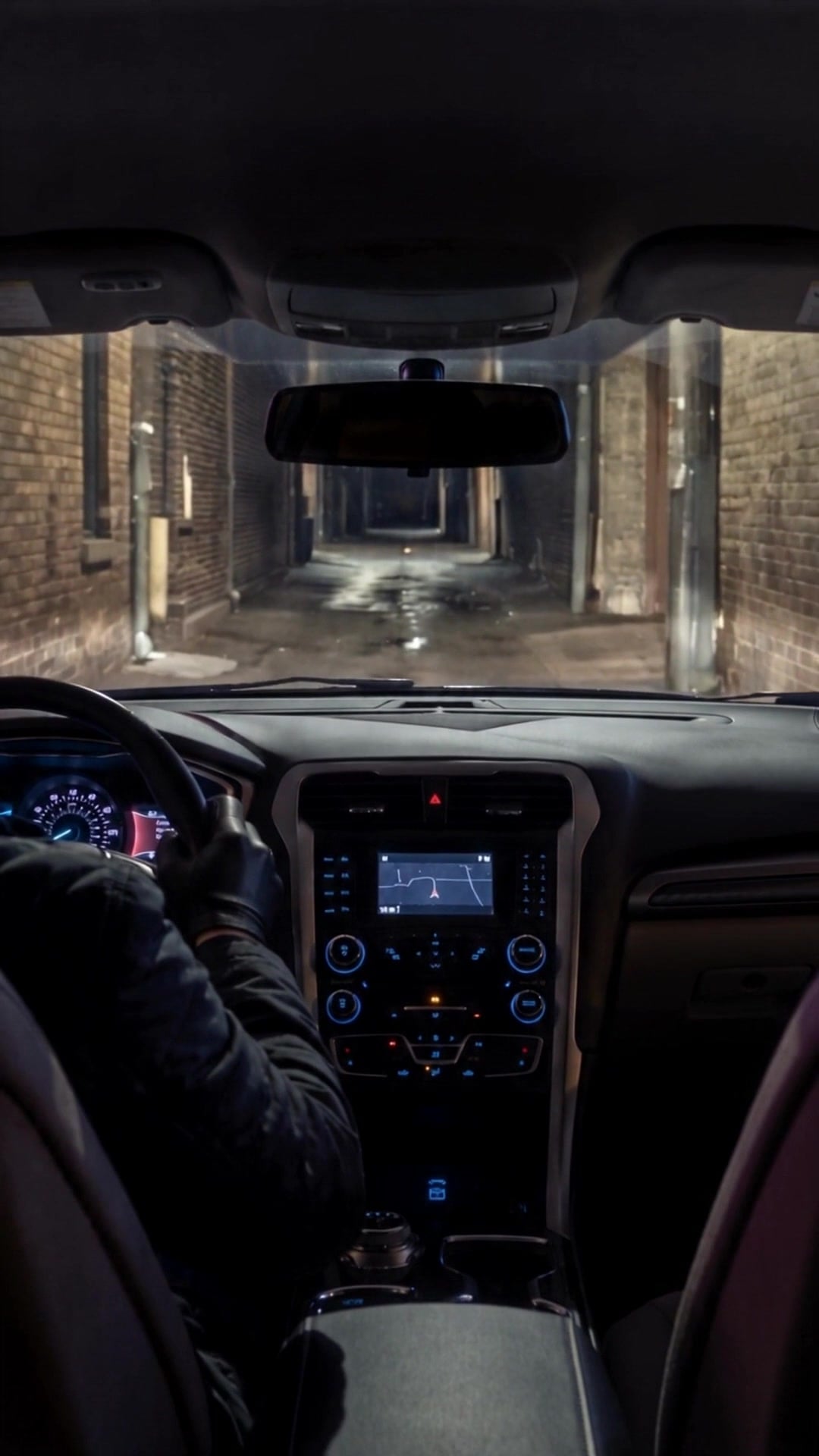 The view from the back seat of a car as the driver turns into a dark alley - Ankin Law dramatization
